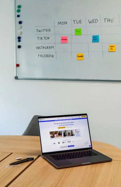 Bright highlighters on a User-Generated Content note against a wooden desk.